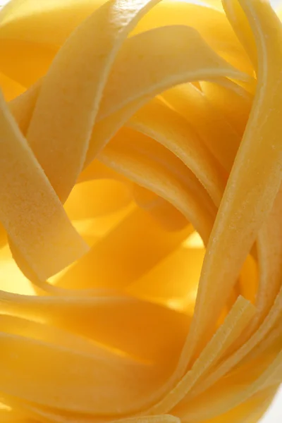 Dried macro noodles yellow pasta, studio shot — Stock Photo, Image