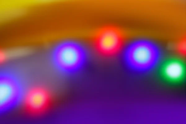 Blurred colorido disco bailando vívidas luces nocturnas — Foto de Stock