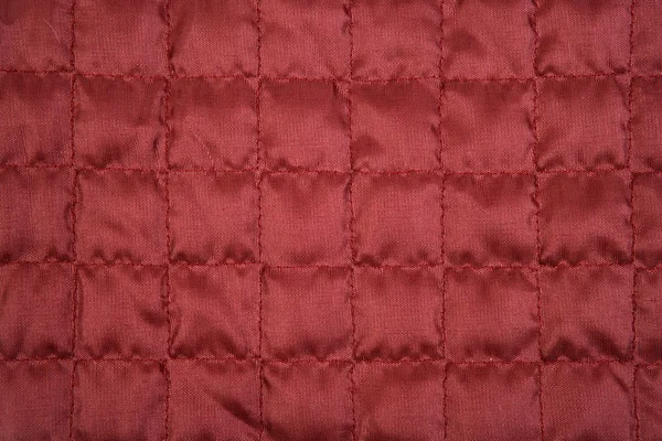 Красная ткань текстуры с пошивом квадратный узор — стоковое фото