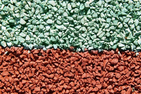 Děti dětské hřiště barevné gumové podlahy makro — Stock fotografie