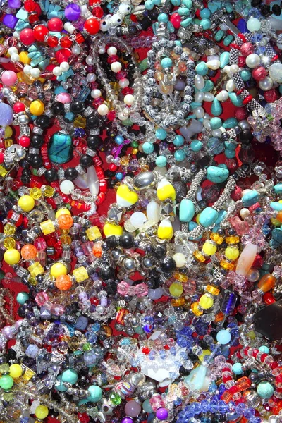 Jewellery mixed colorful many jewels plastic jewelry — Stock Photo, Image