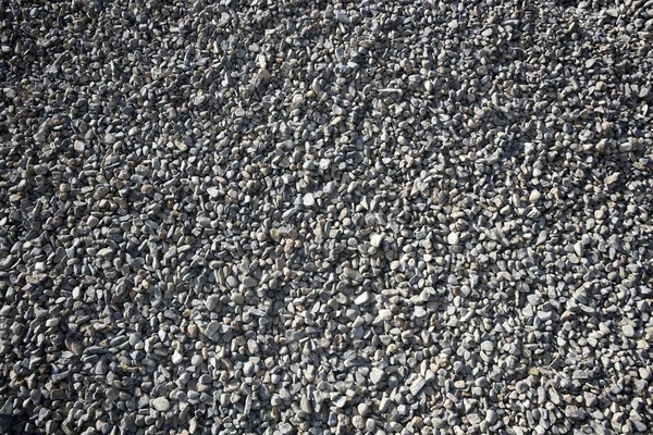 砂利のクローズ アップ グレーの背景色 — ストック写真