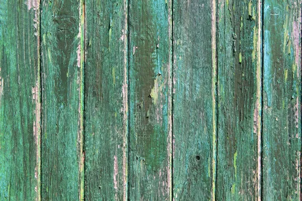 Yaşlı yeşil ahşap boya kapı dokular yan yıpranmış. — Stok fotoğraf