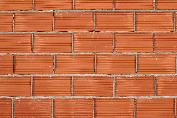 Red clay brick wall construction airbrick — Stock Photo, Image
