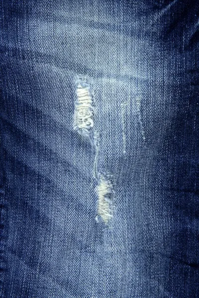 Denim fashion blue jeans broken fabric texture — Stock Photo, Image