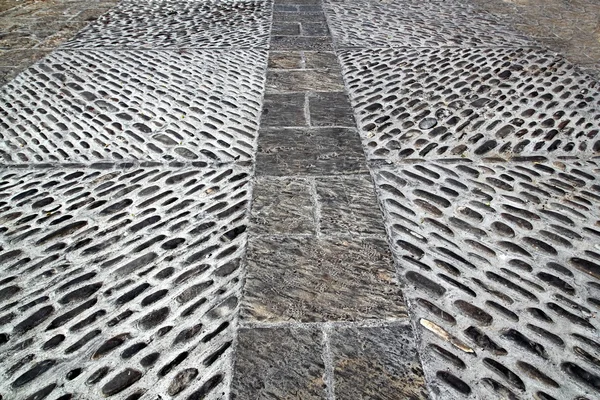 Rolling stones mosaic medieval soil floor Spagna — Foto Stock