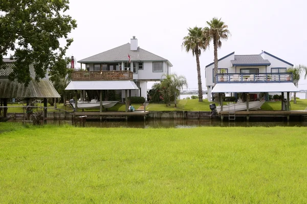 stock image American houses in south Texas river boats