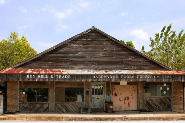 Выдержанный винтажный гранж деревянный техасский магазин — стоковое фото