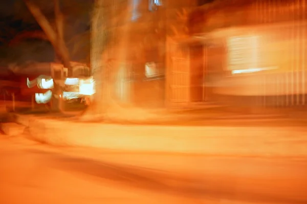Blurred golden orange night city lights — Stock Photo, Image