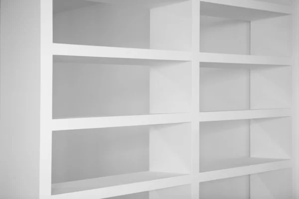 Bookshelf in white empty blank shelfs — Stock Photo, Image