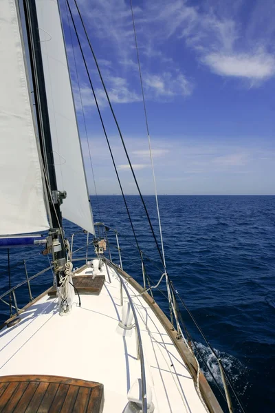 Sailboat sailing blue sea on sunny summer day Royalty Free Stock Photos