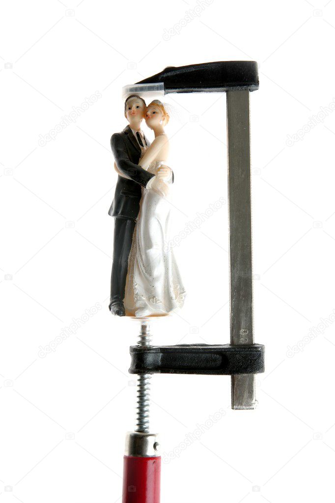 Wedding figurine under pressure