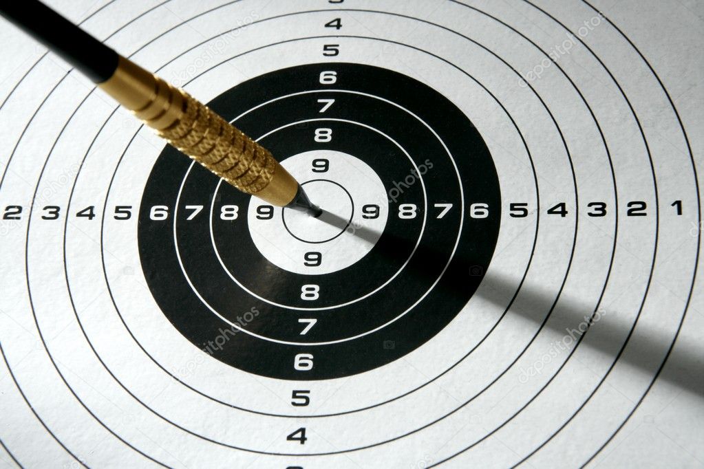 Black and white target with dart and shadows