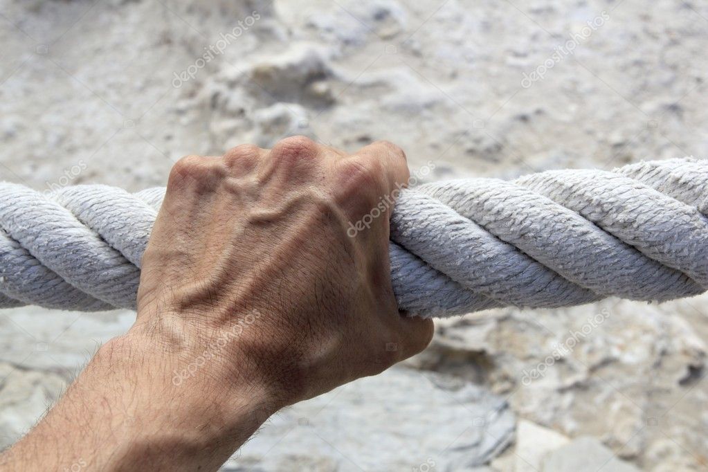 Man hand grab grip strong big aged rope Stock Photo by ©lunamarina