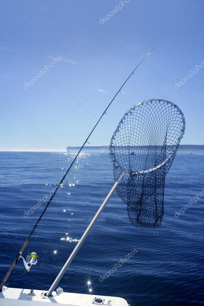 Fishing scoop net on boat in blue sea Stock Photo by ©lunamarina