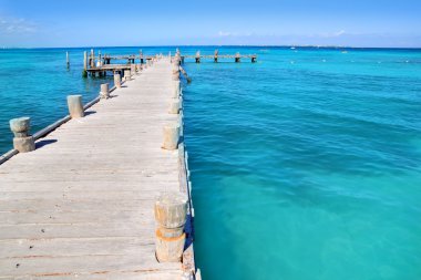 Cancun wood pier in tropical Caribbean sea clipart