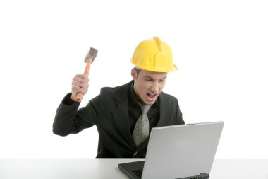 Amgry businessman and hammer with computer clipart