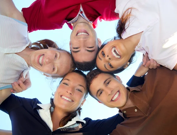 Friends happy group in circle heads from below — Stock Photo, Image