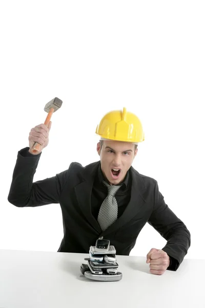 Angry businessman, hammer against telephones — Stock Photo, Image