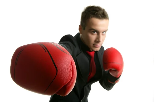 Hombre de negocios con guantes de boxeador rojos — Foto de Stock