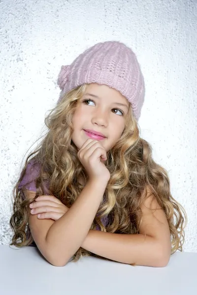Smiling gesture little girl winter pink cap portrait — Stock Photo, Image