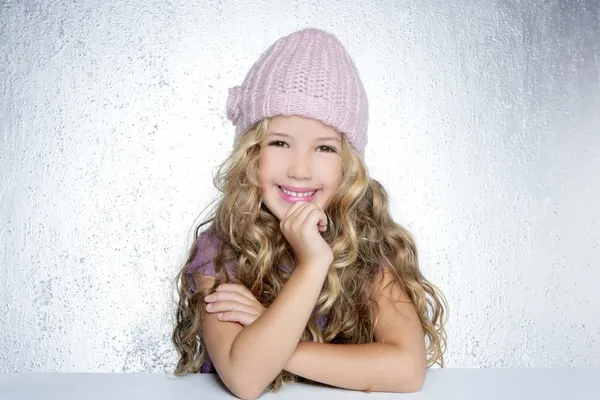 Smiling gesture little girl winter pink cap portrait — Stock Photo, Image