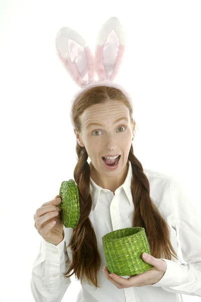 Funny woman holding gift with rabbit ears — Stock Photo, Image