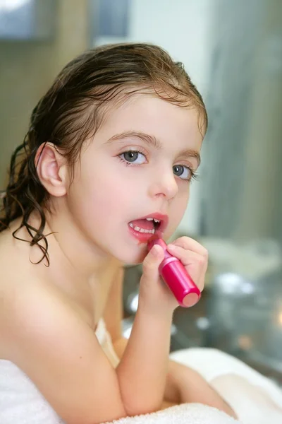 Little girl with lipstick on the bathroom — Stock Photo, Image