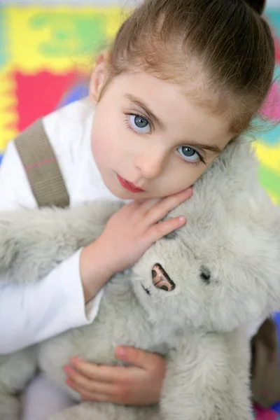 Beautiful little girl hug teddy bear — Stock Photo, Image