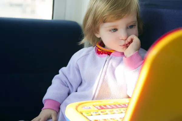 Beautiful toddler little girl with toy computer — Stok fotoğraf