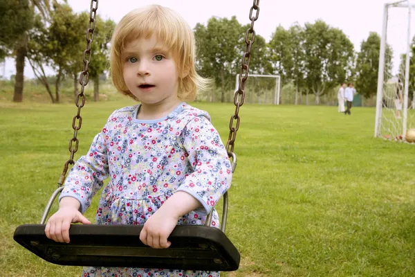 Beautiful toddler blond girl playing on the park — Stock Photo, Image