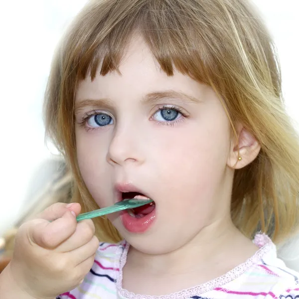 Blond little girl eating ice cream portrait Stock Photo