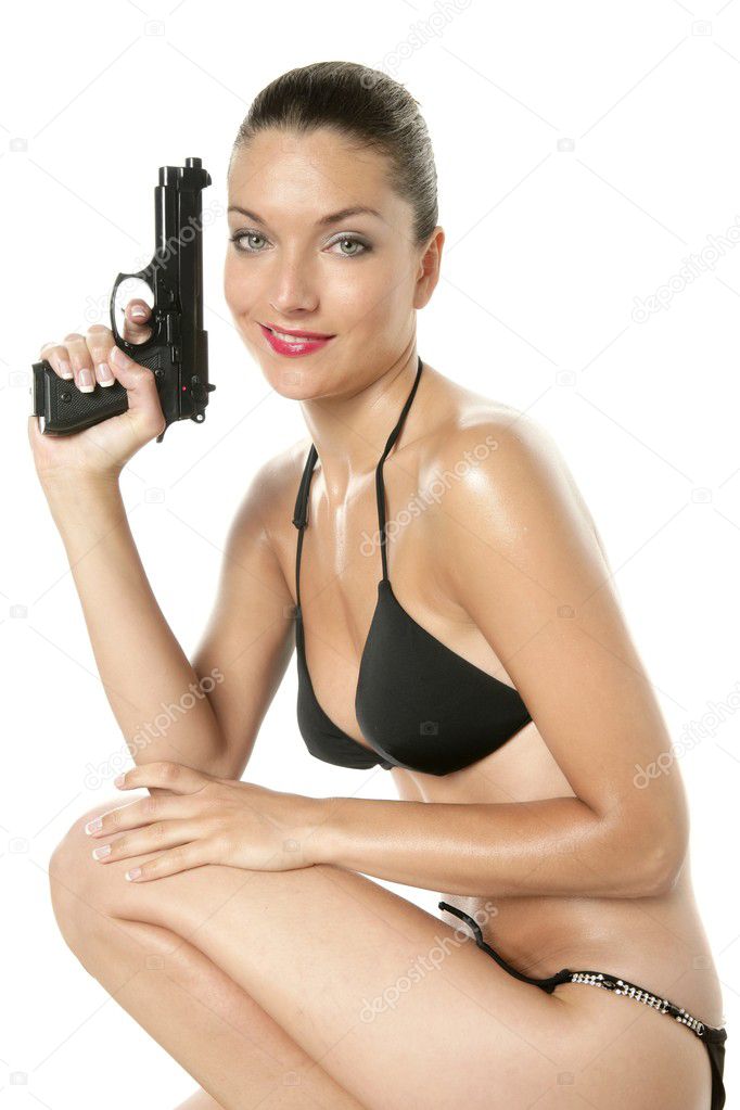 Beautiful sexy woman with black bikini and gun