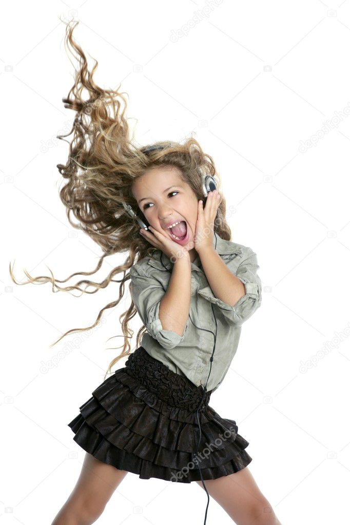 Dancing little blond girl headphones music singing