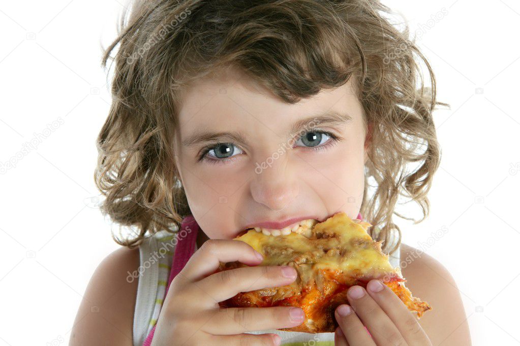 Little girl eating hungry pizza closeup portrait