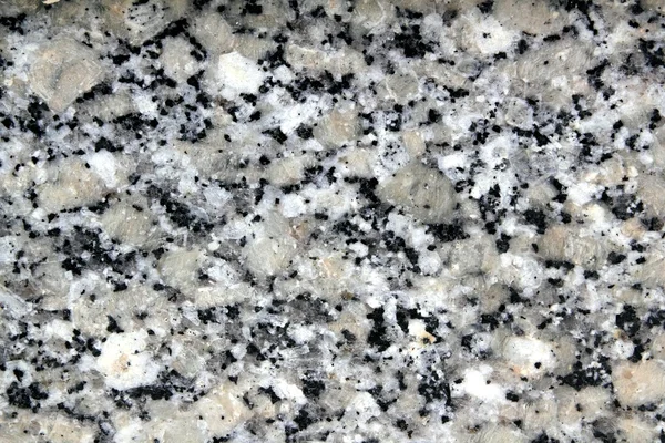 Graniet grijs wit zwarte steen textuur close-up — Stockfoto