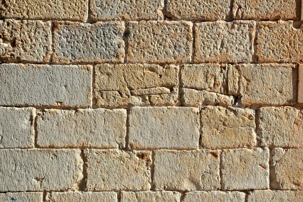 Castle masonry wall carved stone rows pattern texture — Stock Photo, Image
