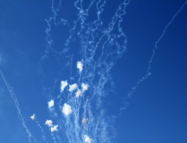 Blue sky with fireworks firecrackers white clouds clipart