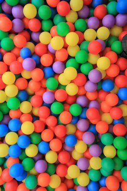 Colorful plastic balls in children park clipart