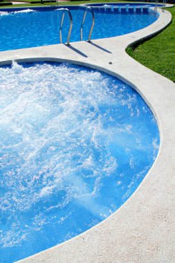 Blue jet spa pool in green grass garden clipart