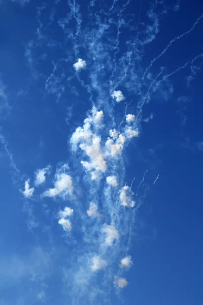 Blue sky with fireworks firecrackers white clouds — Stock Photo, Image