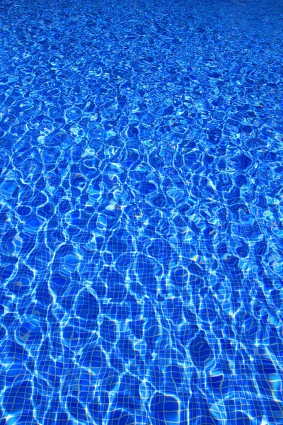 Blue tiles swimming pool water reflection texture — Stock Photo, Image