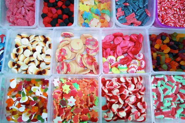 Godis färgglada sötsaker gelé i lådor mönster — Stockfoto