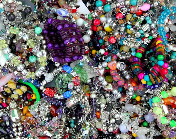 Colorful jewellery mixed mess in a retail market — Stock Photo, Image