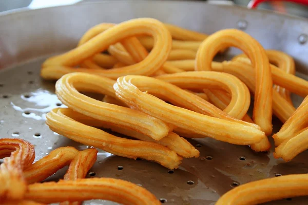 Churros fried with oil unhealthy food — Stock Photo, Image