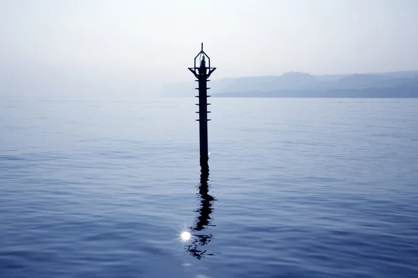 Backlight beacon in Mediterranean blue sea reflection — Stock Photo, Image