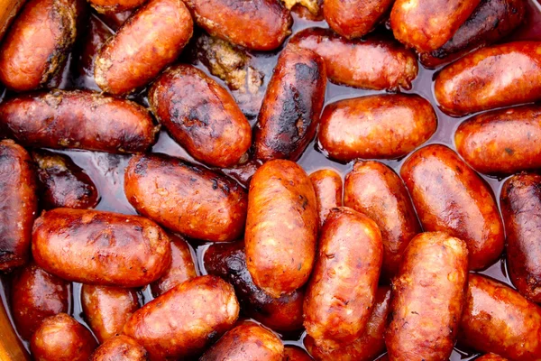 Salchichas rojas de chorizo fritas en aceite —  Fotos de Stock