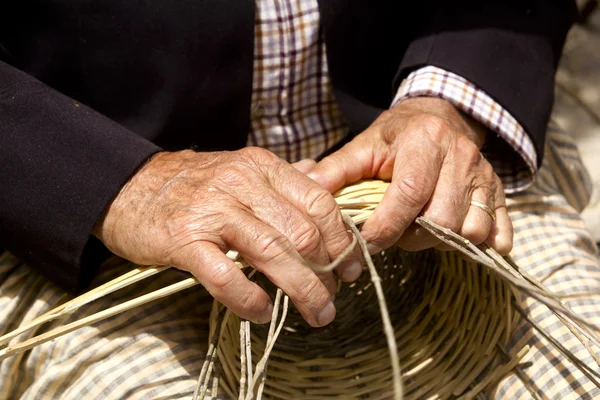 stock image Basketry craftsman hands working in Mediterranean basket