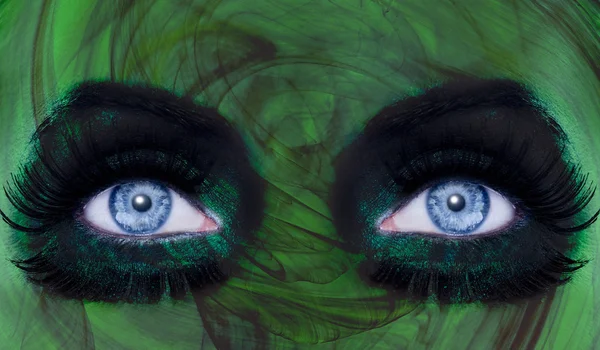 Abstract blue eyes makeup woman green texture — Stock Photo, Image