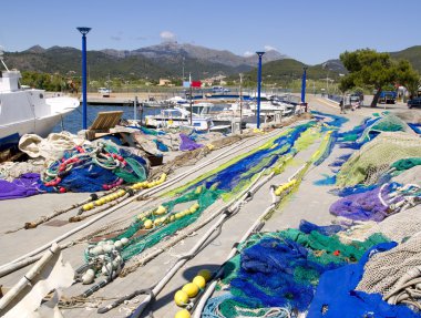 Fishing nets and tackle in Andratx port from mallorca clipart